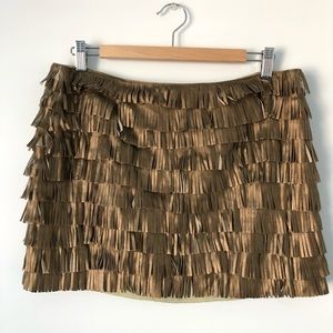 Metallic fringe skirt.